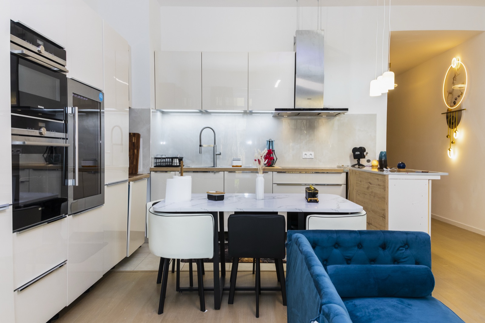 The open kitchen and the big shared table